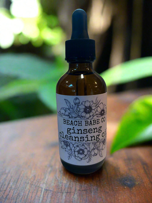 Bottle with dropper labeled 'Beach Babe Co.' on a white background